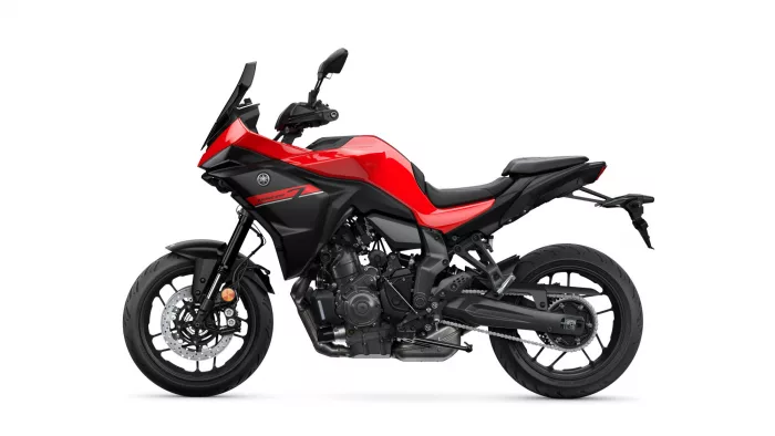 Red and black Yamaha Tracer sport motorcycle shown in profile against a white background, left-side view with prominent fairing and windshield.