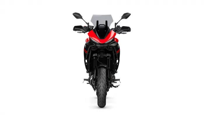 Front view of a red and black Yamaha sport motorcycle with windshield and handlebars visible.