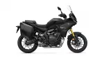 Side view of a black Yamaha Tracer GT sport-touring motorcycle with panniers and a tall windshield
