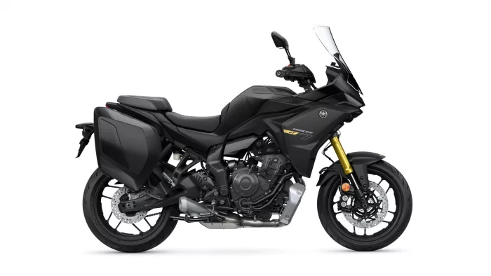 Side view of a black Yamaha Tracer GT sport-touring motorcycle with panniers and a tall windshield