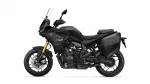 Black Yamaha Tracer 7 GT sport-tourer shown in profile with integrated side panniers and tall windscreen