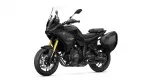 Yamaha Tracer GT sport motorbike in black with gold front forks and side cases, shown from a front-side angle.