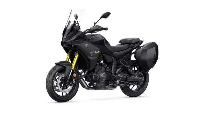 Yamaha Tracer GT sport motorbike in black with gold front forks and side cases, shown from a front-side angle.