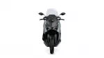 Front view of a gray and black sport motorcycle with a tall windshield and dual headlights.