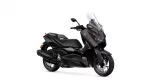 Brown/black Yamaha sport-touring scooter with a tall windshield and dual front headlights, shown from a right-front angle
