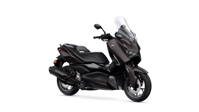 Brown/black Yamaha sport-touring scooter with a tall windshield and dual front headlights, shown from a right-front angle