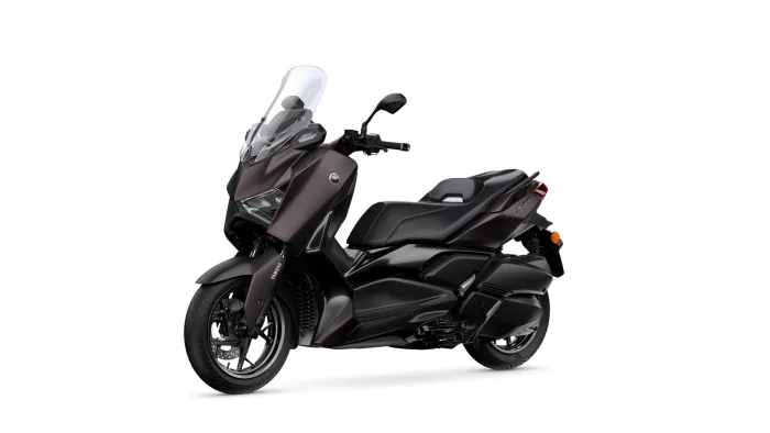 Yamaha XMAX scooter with tall windshield, shown from front-left view in dark color