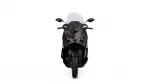 Front view of a black motorcycle with a tall windscreen and dual angular headlights.