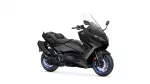 Side view of a black Yamaha sport motorcycle with a clear windshield and blue-rimmed wheels