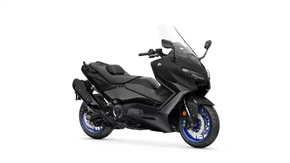 Side view of a black Yamaha sport motorcycle with a clear windshield and blue-rimmed wheels