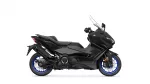 Side view of a black Yamaha TMAX scooter with blue rims and sporty styling