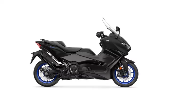 Side view of a black Yamaha TMAX scooter with blue rims and sporty styling