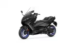 Black Yamaha TMAX sport scooter shown from the front-left side with a tall windshield and blue-rimmed wheels in a white background.