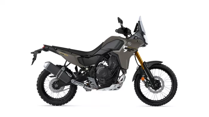 Side view of a Yamaha Tenere 700 adventure motorcycle with a tall windshield viewed from the right side.