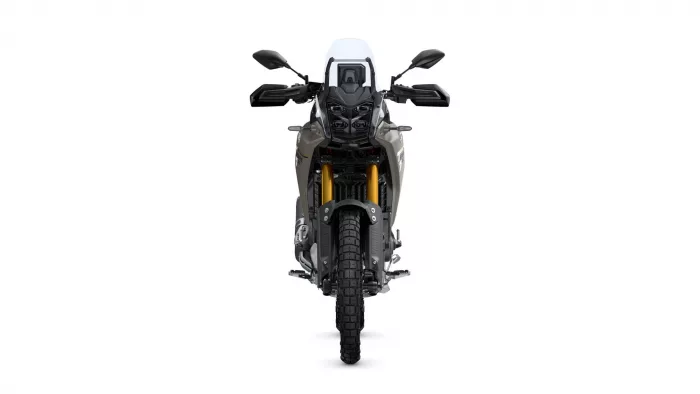 Front view of a modern adventure motorcycle facing the camera, with a white windscreen and gold front forks visible.
