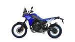 Blue Yamaha Tenere 700 adventure motorcycle photographed from the left side, showing off-road tires and windscreen