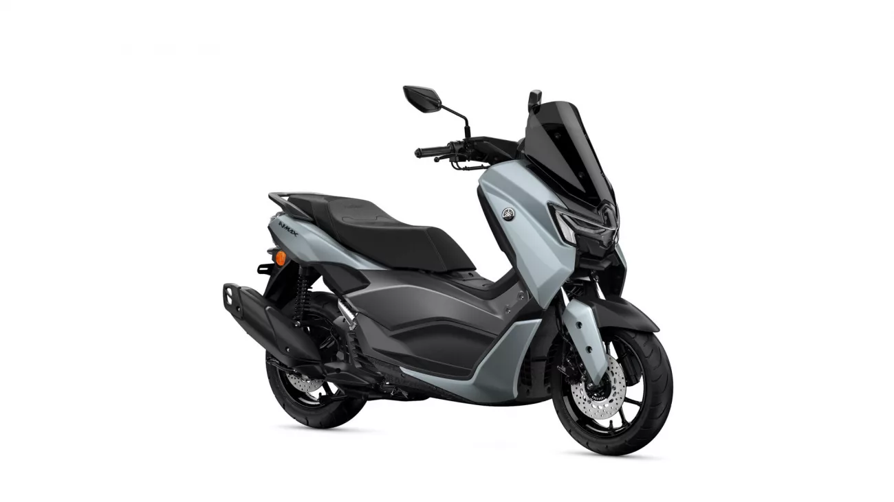 Yamaha NMAX scooter in silver and black, shown from a front-right angle with a tall black windscreen and mirrors.