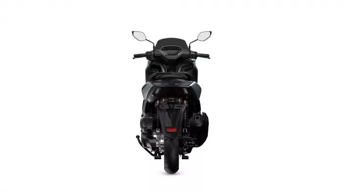 Rear view of a black motorcycle centered on a white background, showing the taillight, rear wheel, and exposed chassis area.