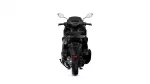 Rear view of a black sport motorcycle on a white background, showing taillights and rear wheel.
