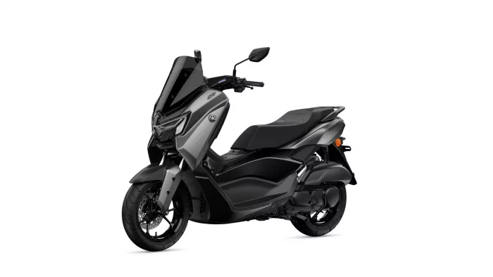 Gray Yamaha scooter, photographed from the front-left, showing a tall windshield, angular headlight, and two-tone bodywork with a comfortable seat.