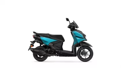 Side view of a teal and black Yamaha scooter on a white background.