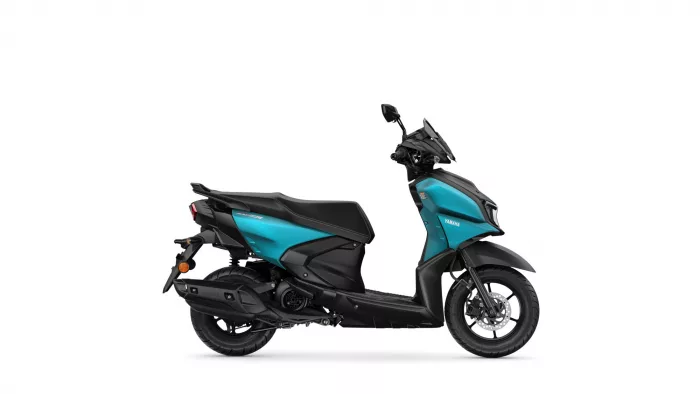 Side view of a teal and black Yamaha scooter on a white background.
