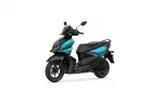 Teal and black Yamaha scooter shown from a front-left side angle with windshield and mirrors against a white background.