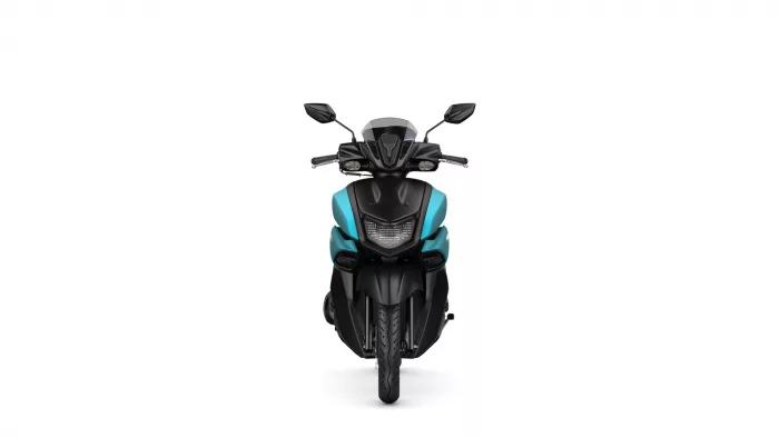 Front view of a black-and-teal motorcycle, showing windshield, handlebars, and dual headlights
