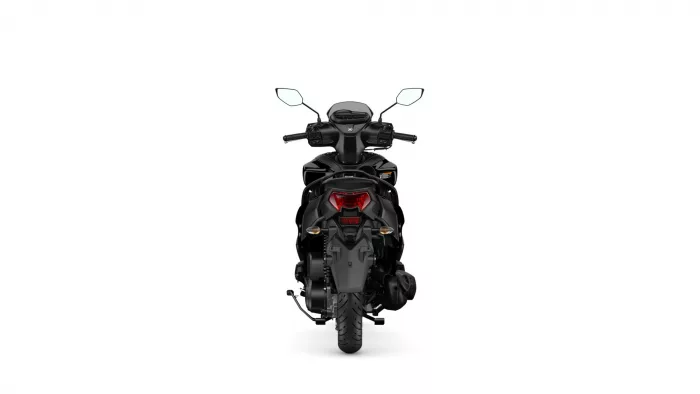 Rear view of a black motorcycle/scooter showing the taillight, seat, and rear wheel from behind.