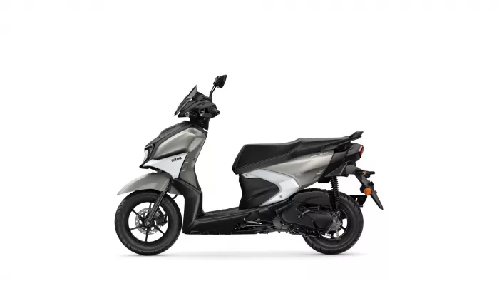 Side view of a Yamaha scooter in grey and black, showing the front wheel, seat, and rear at left to right.