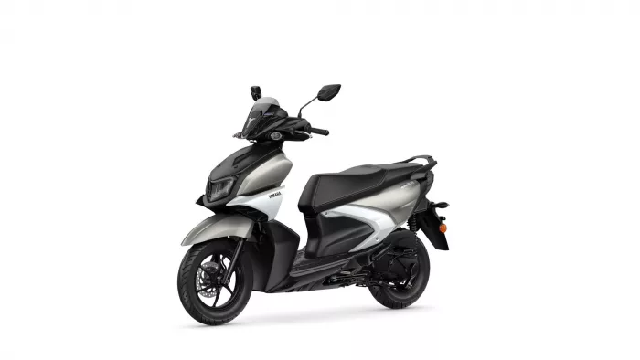Black and silver Yamaha scooter photographed from a front-left angle, showing the windshield and handlebars.