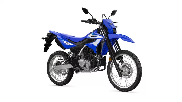 Blue Yamaha dirt bike shown in a left-front-quarter view on a white background, highlighting its blue bodywork and knobby tires.