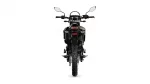 Rear view of a black motorcycle with side mirrors, taillight, and rugged rear tire against a white background.