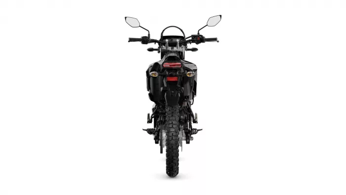 Rear view of a black motorcycle with side mirrors, taillight, and rugged rear tire against a white background.
