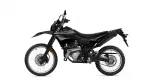 Side view of a black Yamaha dirt bike with knobby off-road tires and exposed engine details, ready for trail riding.