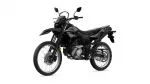 Black Yamaha dual-sport motorcycle shown in a three-quarter front-left view with knobby off-road tires and rugged styling on a white background, front disc brake visible.