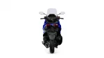 Rear view of a blue sport motorcycle with taillights, exhaust, and tall windshield