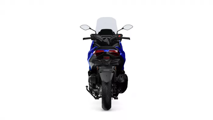 Rear view of a blue sport motorcycle with taillights, exhaust, and tall windshield