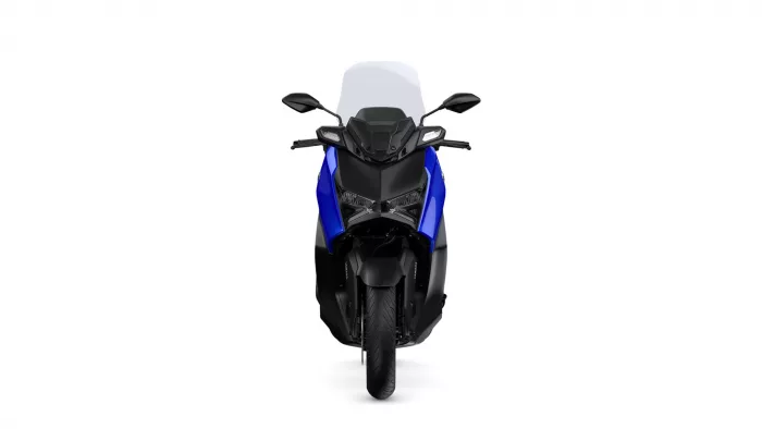 Front view of a blue and black sport motorcycle with a tall windshield and angular headlights, seen head-on against a white background.