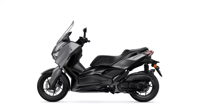 Side view of a gray Yamaha XMAX scooter with windshield
