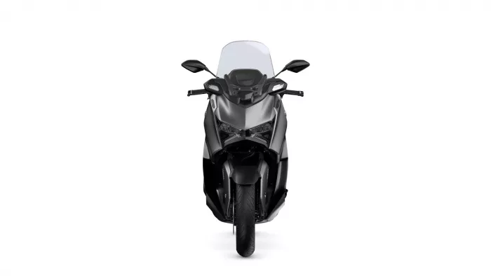 Front view of a black sport motorcycle with a tall windscreen against a white background