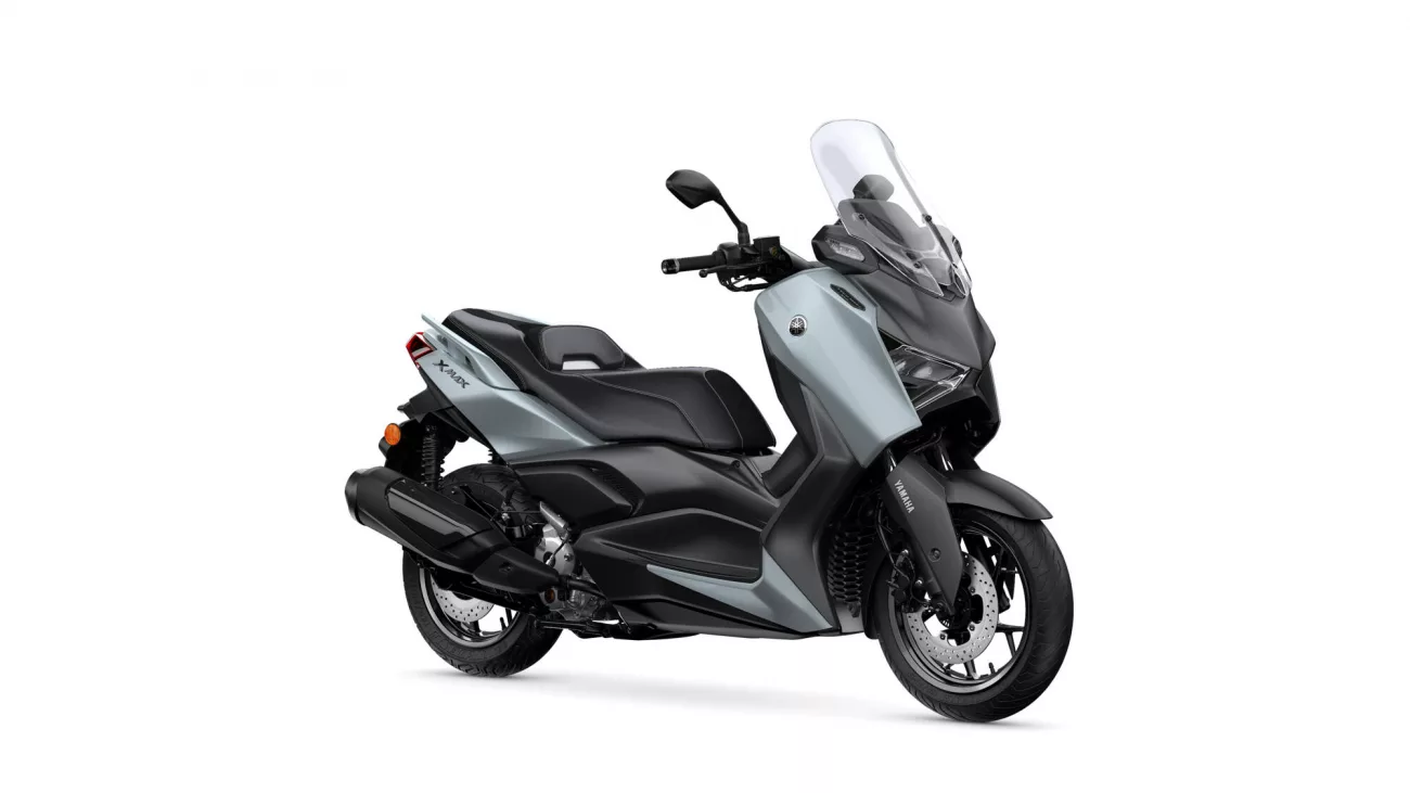 Gray and black Yamaha XMAX scooter shown in a three-quarter front view with a tall windshield