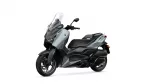 Left-side view of a gray and black Yamaha XMAX scooter with a tall clear windshield