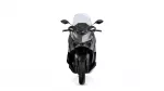 Front view of a black sport motorcycle with a tall windshield and angular headlights viewed head-on.