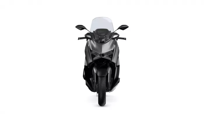 Front view of a black sport motorcycle with a tall windshield and angular headlights viewed head-on.