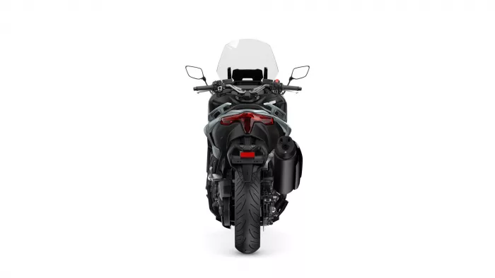 Rear view of a black sport motorcycle with a tall, clear windscreen and prominent red taillight.