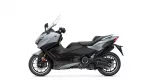 Side view of a gray and black Yamaha sport-touring motorcycle with a tall windshield? front wheel visible (left side).