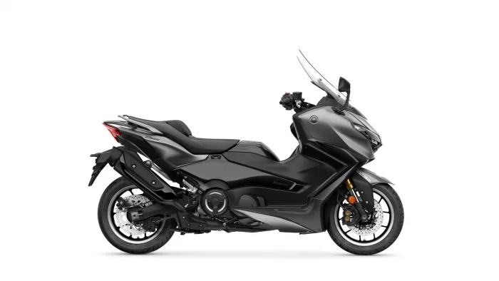 Left-side view of a black Yamaha TMAX sport scooter with a tall clear windshield.