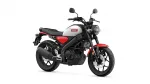 Side view of a Yamaha motorcycle with gray fuel tank, red accents, and black frame, facing right