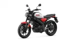 Yamaha motorcycle shown in a white-and-red color scheme, front three-quarter view with round headlight and black frame on white background